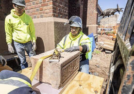 Construction workers removing the cornerstone at Peabody Museum of Natural History, photo by Dan Renzetti